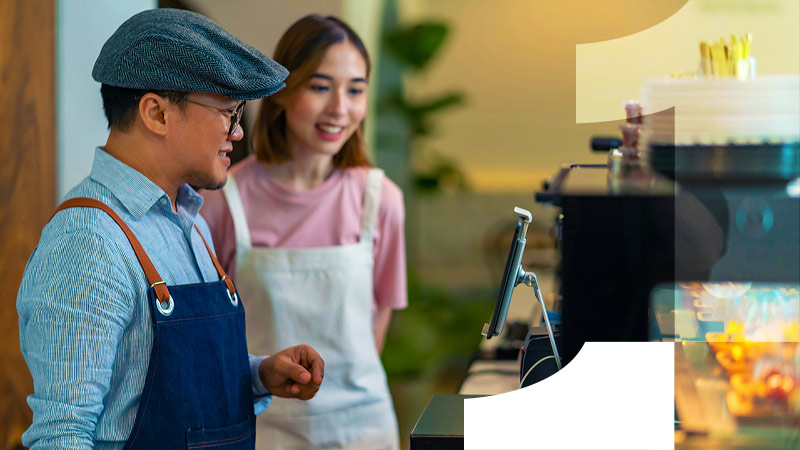 man and woman at shop desk