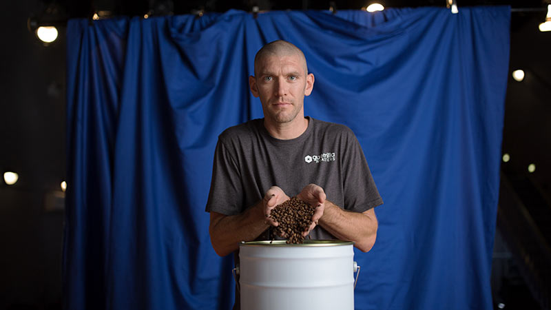 Photo of one of the owners of Guerrilla Roasters, a small coffee production business that can be found in a local business search