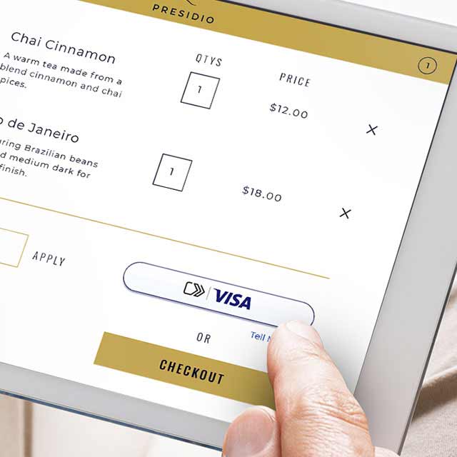 Closeup of a tablet displaying the new Visa checkout experience.